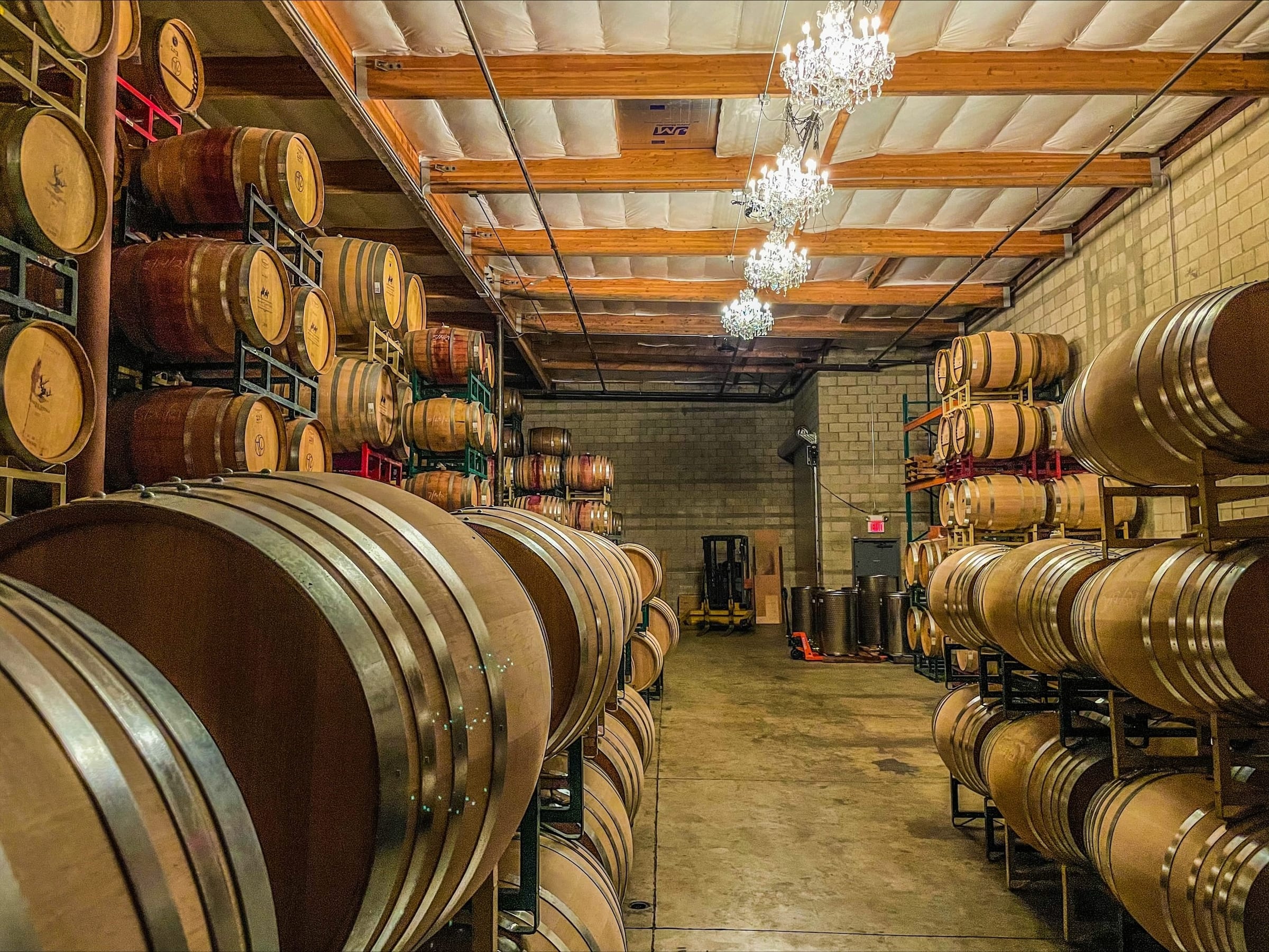Oak barrels stacked in the barrel room
